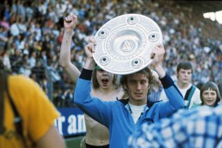Rainer Bonhof holds the Bundesliga shield after Borussia Monchengladbach's title success in 1974/75.