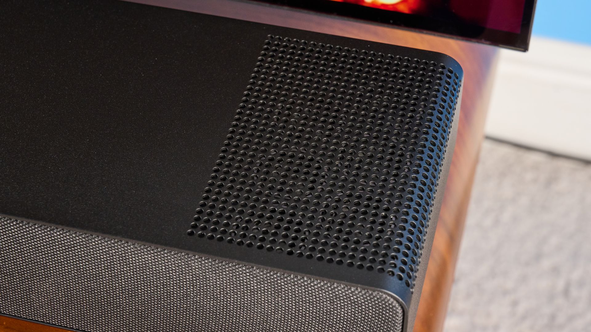 the yamaha true x surround 90a soundbar with dolby atmos, subwoofer, surround rear wireless speakers, and a 5.1.4 channel configuration photographed alongside a TV