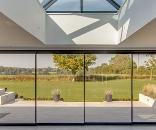 Room wide sliding doors looking onto very large garden