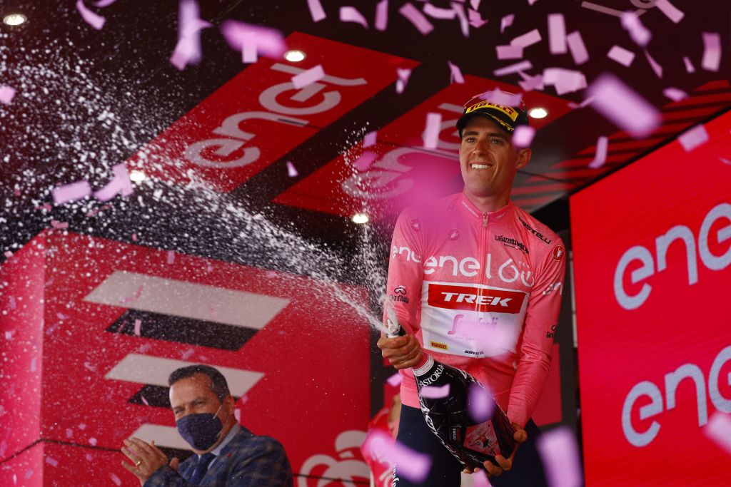 Overall leader Team Treks Spanish rider Juan Pedro Lopez celebrates on the podium after the 4th stage of the Giro dItalia 2022 cycling race 174 kilometers between Catania and Messina Sicily on May 11 2022 Photo by Luca Bettini AFP Photo by LUCA BETTINIAFP via Getty Images