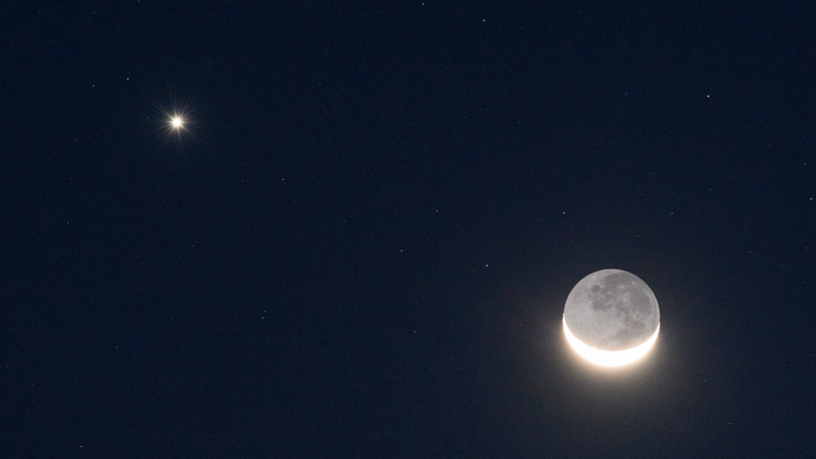 Venus and crescent moon next to each other.