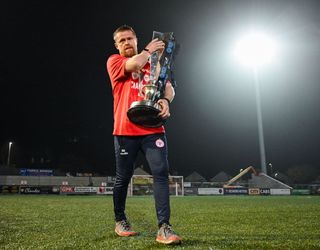 Derry , United Kingdom - 1 November 2024; Shelbourne manager Damien Duff with the SSE Airtricity Premier Division trophy after his side's victory in the SSE Airtricity Men's Premier Division match between Derry City and Shelbourne at The Ryan McBride Brandywell Stadium in Derry. (Photo By Stephen McCarthy/Sportsfile via Getty Images)