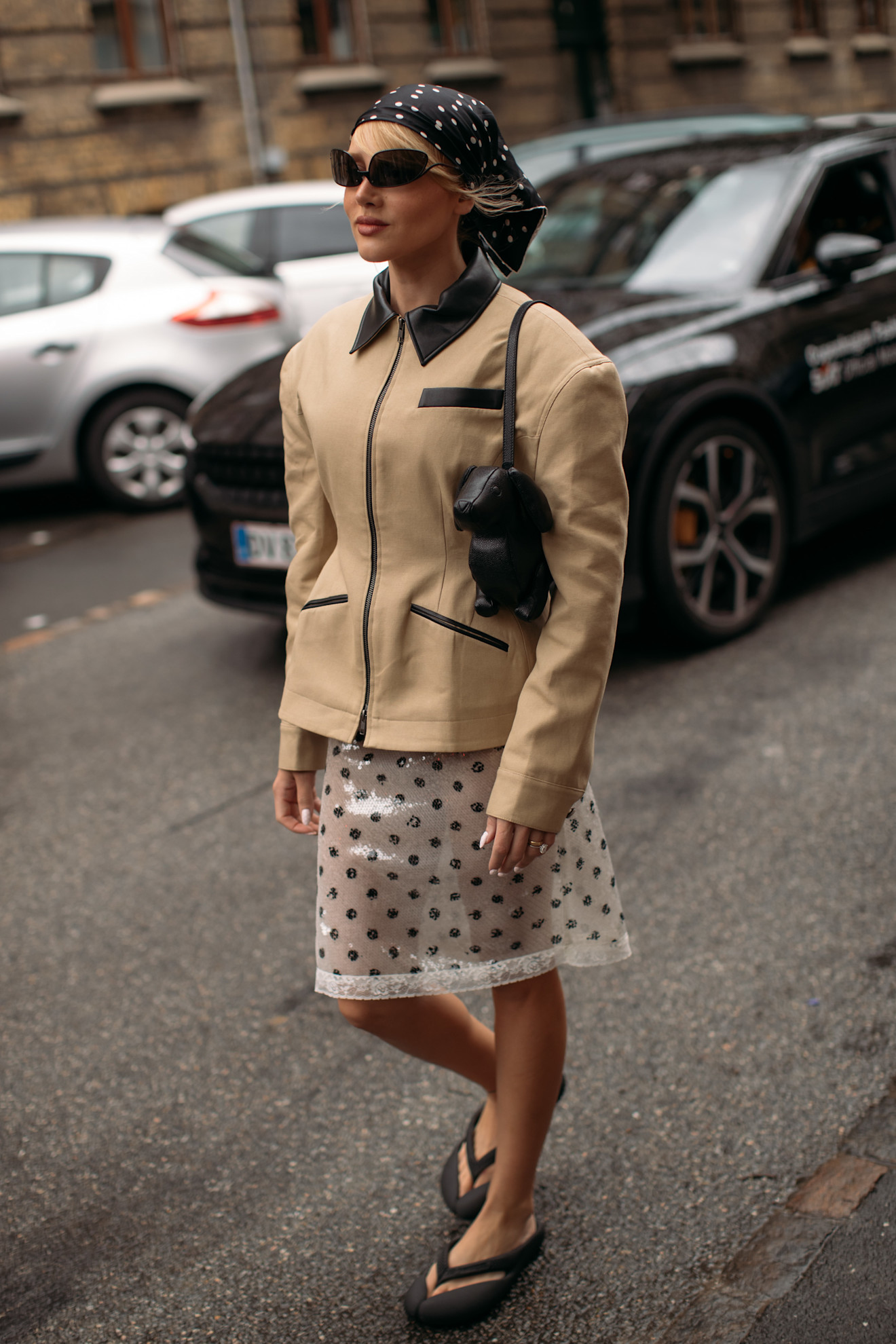 guests at Copenhagen Fashion Week style flip flops with pants, suits, and barn jackets