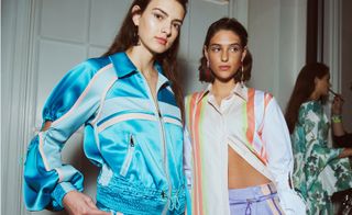 Urban hints came in silk tracksuit trousers and bomber jackets, and striped bias-cut dresses and shirts, finished with sporty drawstring pulls.
