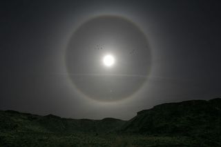 Light being refracted in the atmosphere of the Earth can sometimes create a halo around the sun or moon. Similarly, light from another star being refracted in an exoplanet atmosphere can cause an increase in the amount of light detected from the star just before the planet transits.