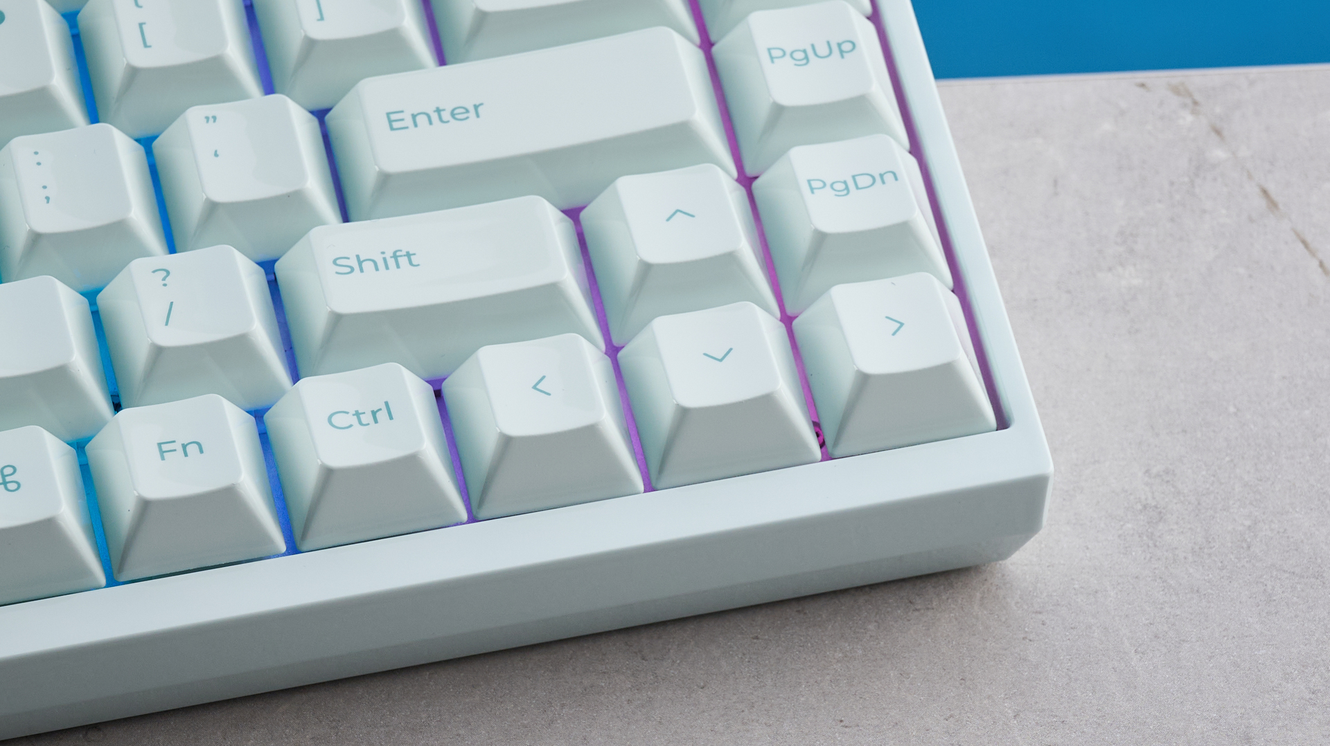 The Keychron Q16 HE 8K in light green on a stone surface