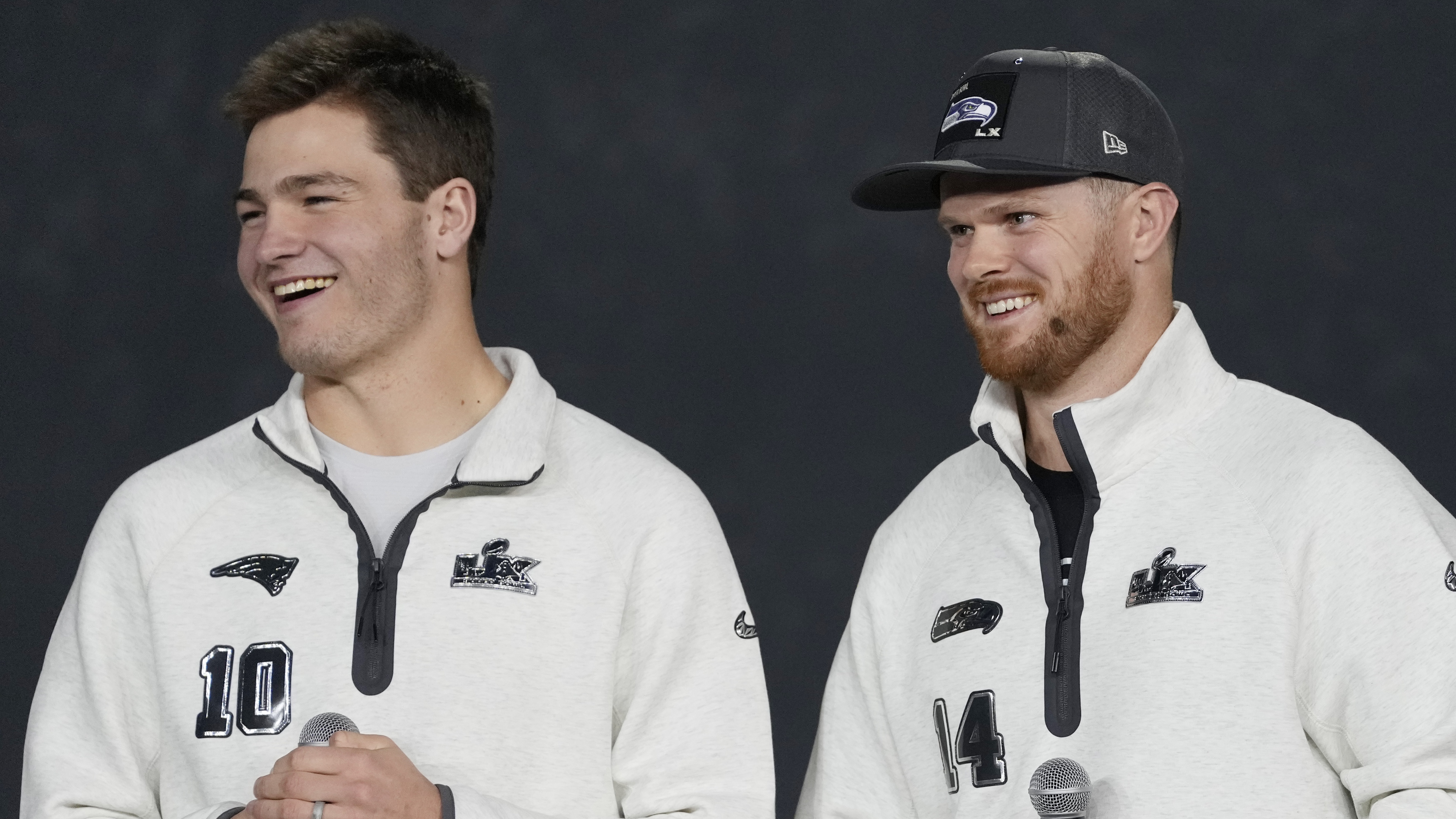 Sam Darnold #14 of the Seattle Seahawks and Drake Maye #10 of the New England Patriots look on during Super Bowl LX Opening Night at San Jose McEnery Convention Center on February 02, 2026 in San Jose, California