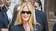Nicole Kidman in black rectangle glasses and a blazer