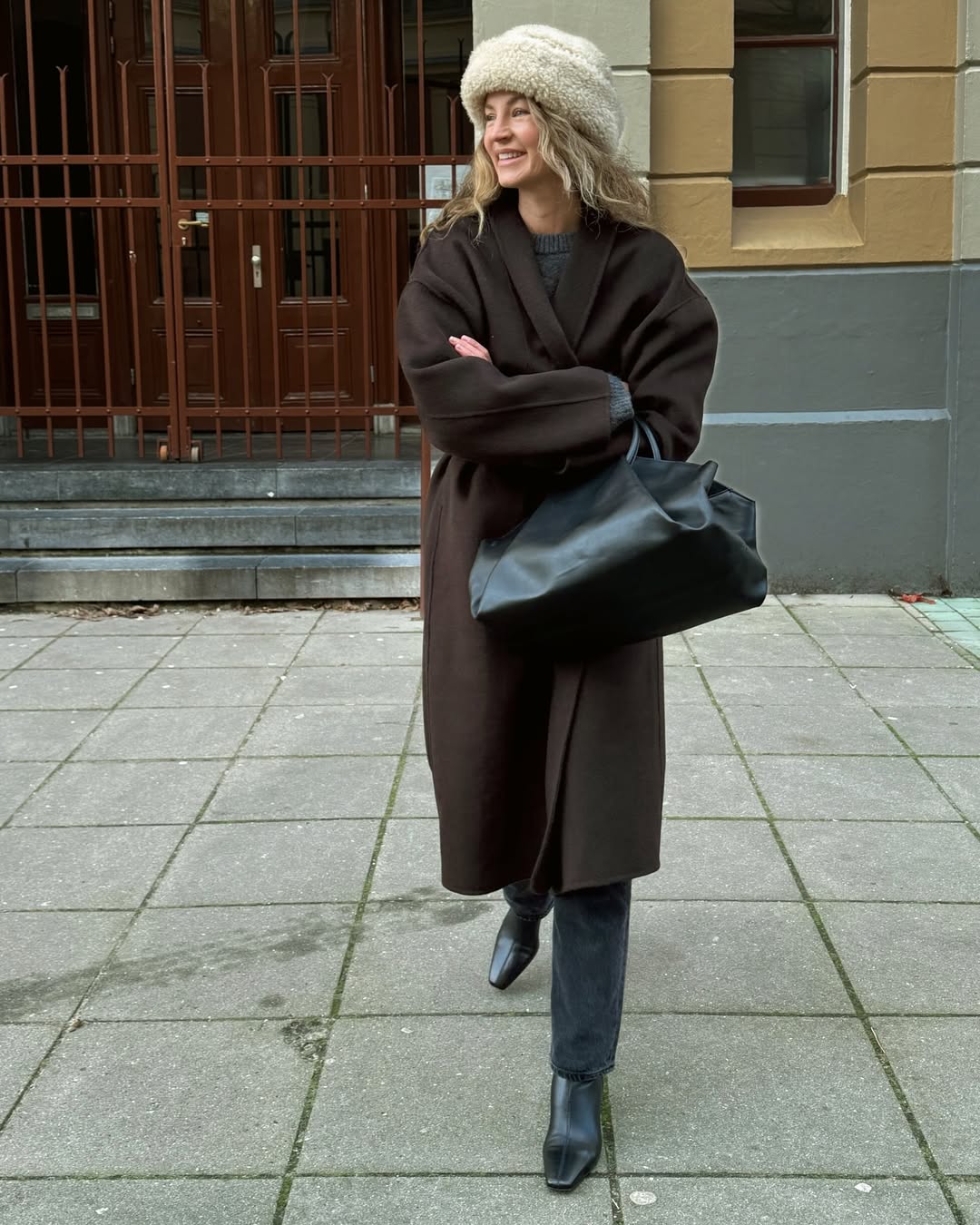 Anouk in a brown wool coat