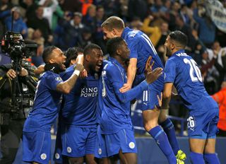 Leicester City players celebrate after captain Wes Morgan's goal against Sevilla at the King Power Stadium in the 2016/17 UEFA Champions League last 16