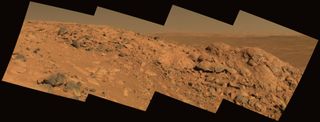 Columbia Hills is another of NASA's top three choices for landing the upcoming Mars 2020 rover. This photograph was taken by NASA's Spirit rover; Gusev crater can be seen on the horizon behind a rock outcrop called "Longhorn."
