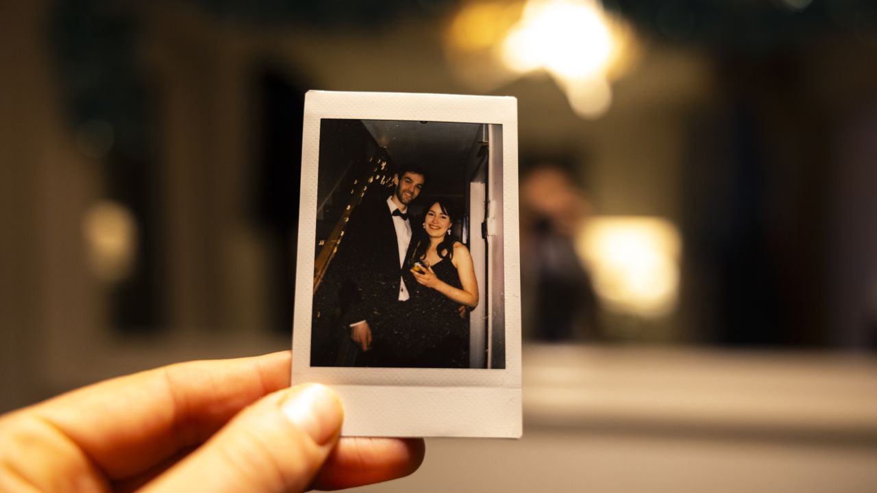 A couple at a party on an Instax Mini print