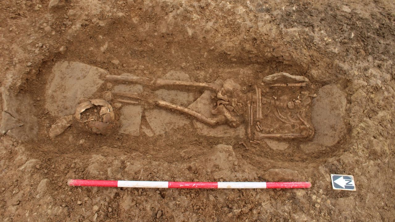A grave with a skeleton inside