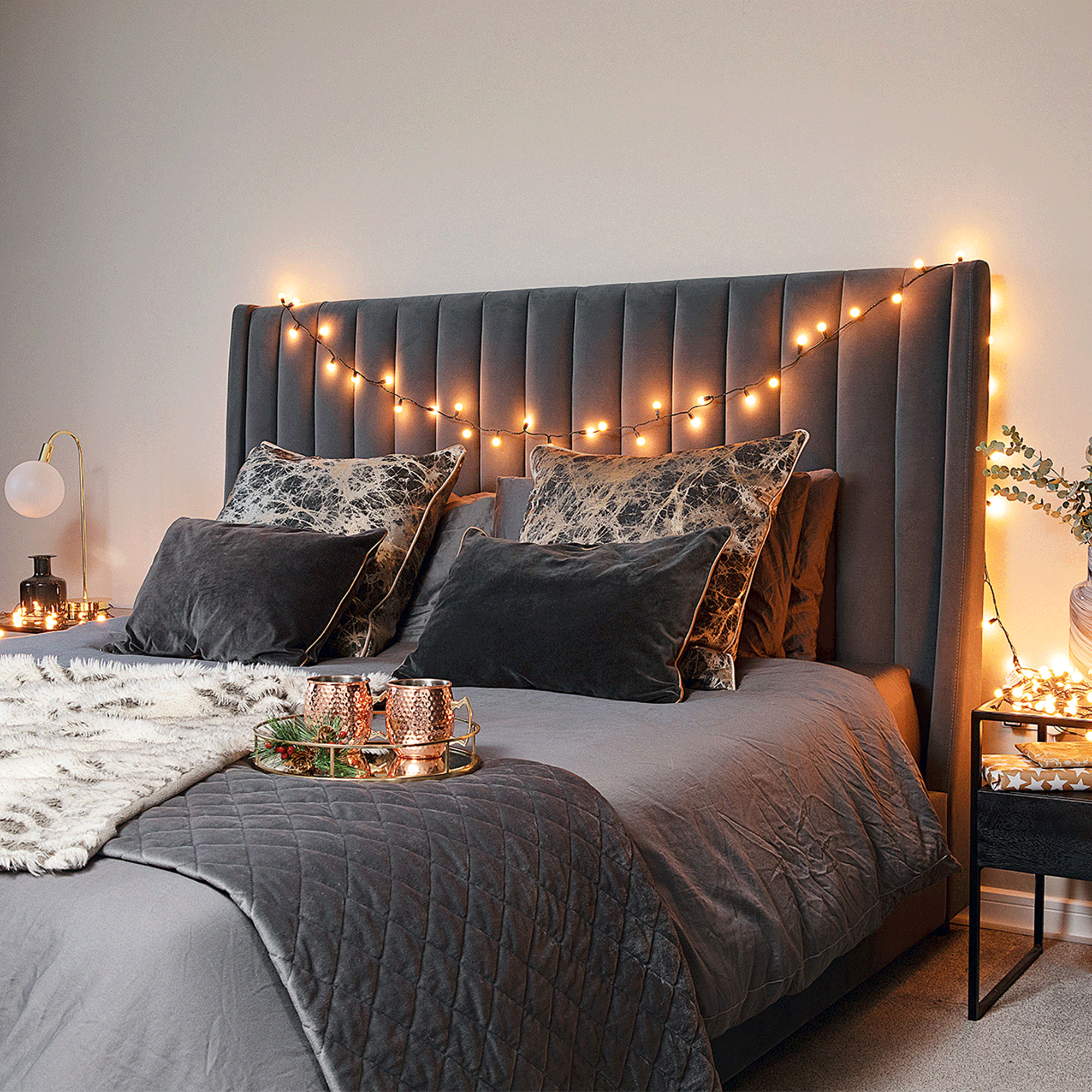 Grey bed with fairy lights