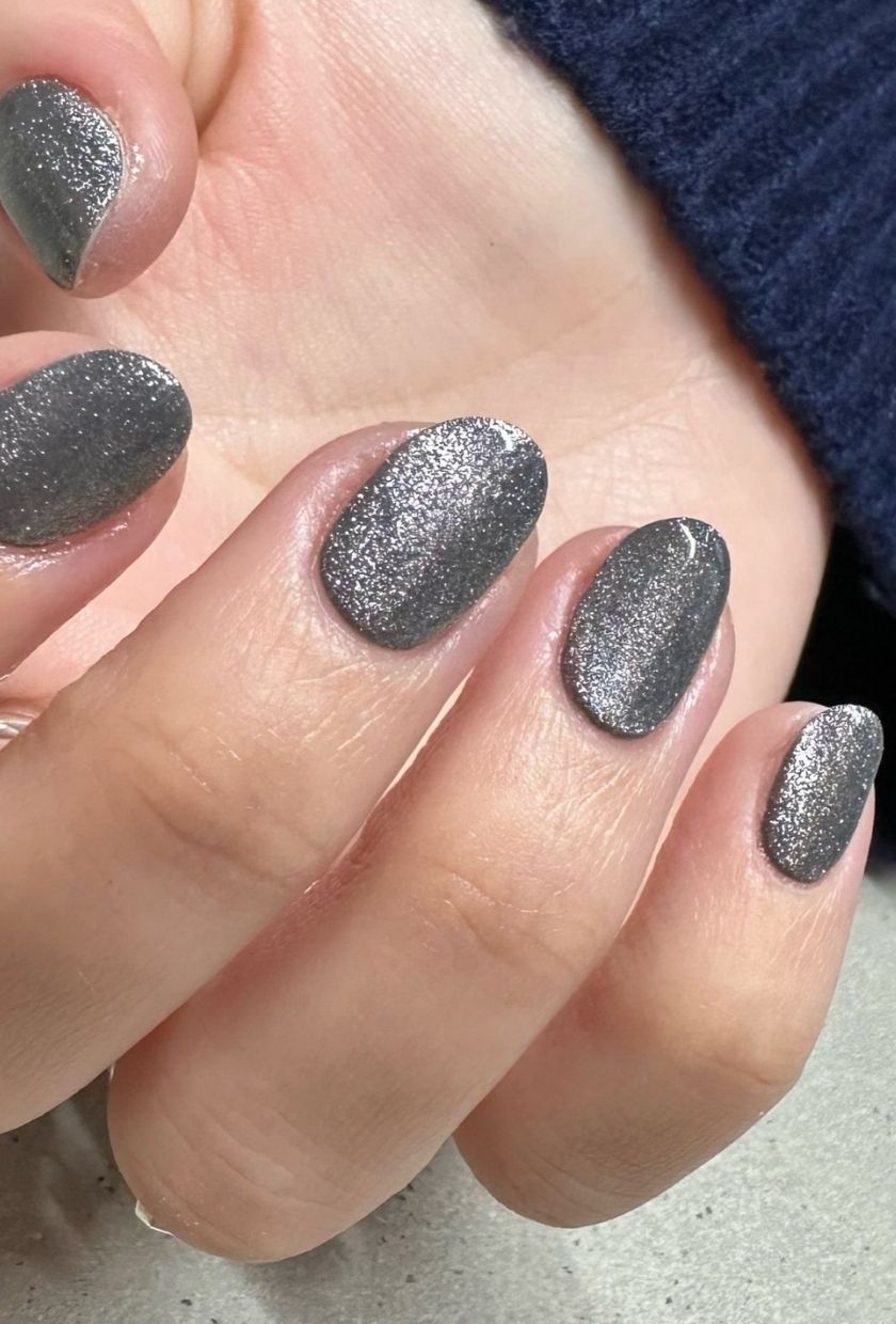a close-up shot of silver velvet nails