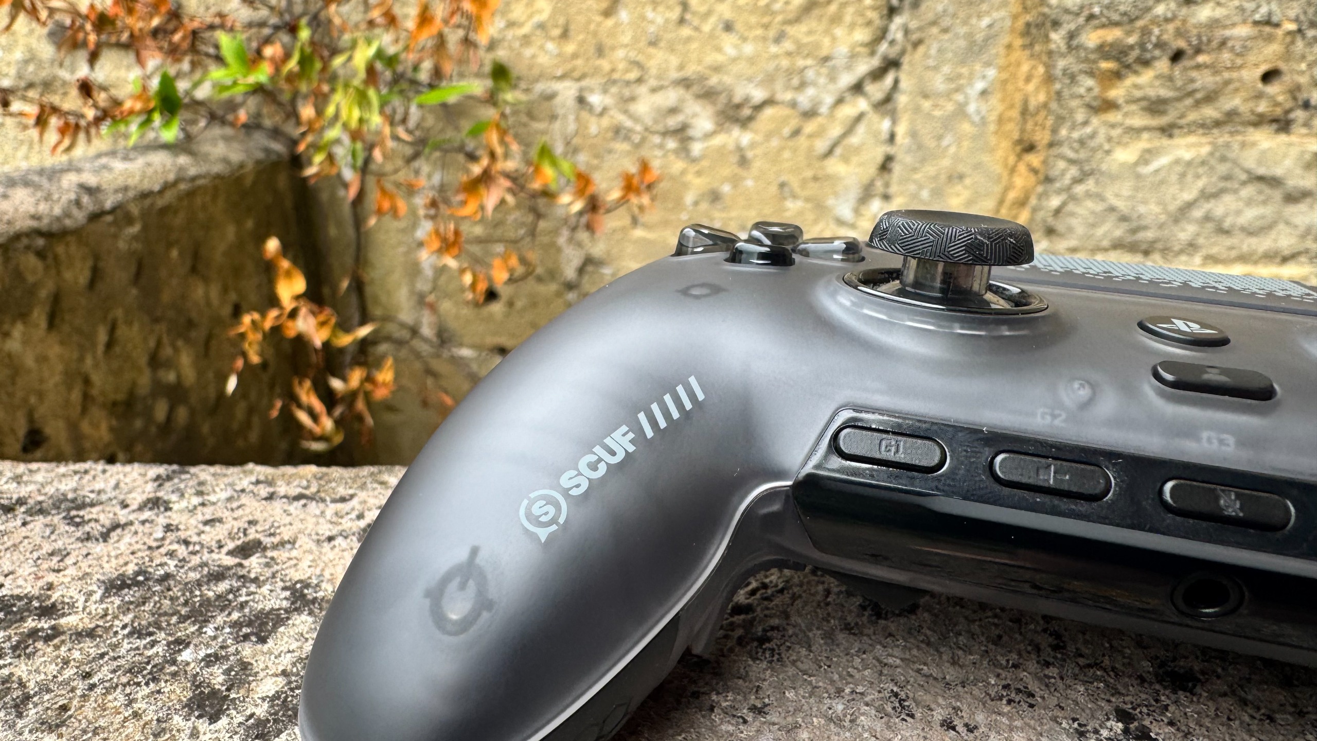 Scuf Omega controller outside from the bottom right, showing the Scuf logo