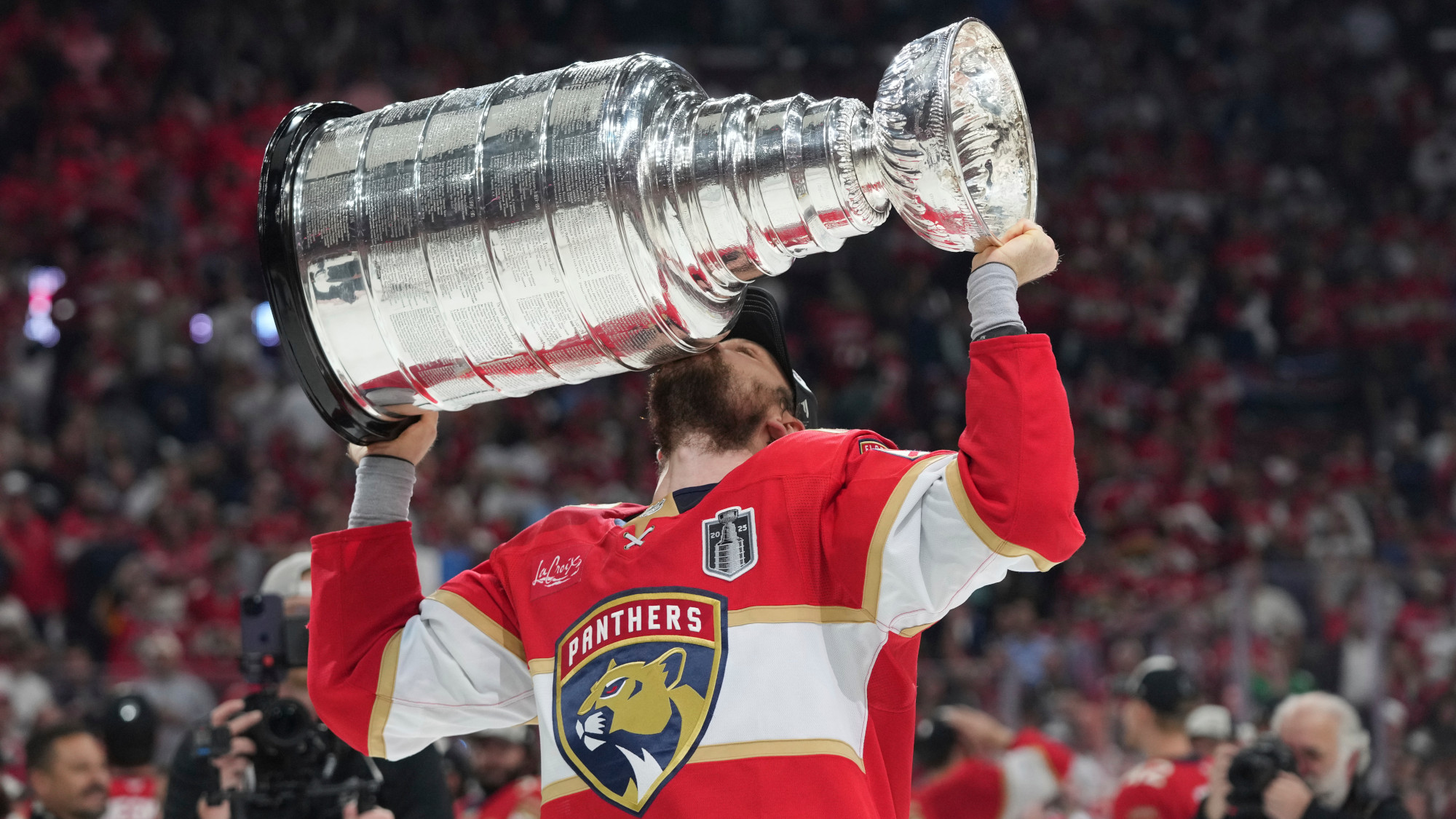 Sam Reinhart holding the Stanley Cup