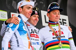 French Romain Bardet of Team DSM-Firmenich PostNL, Slovenian Tadej Pogacar of UAE Team Emirates and Dutch Mathieu van der Poel of Alpecin-Deceuninck celebrate on the podium after the men elite race of the Liege-Bastogne-Liege one day cycling event, 254,5 km km from Liege, over Bastogne to Liege, Sunday 21 April 2024. BELGA PHOTO ERIC LALMAND (Photo by ERIC LALMAND / BELGA MAG / Belga via AFP)