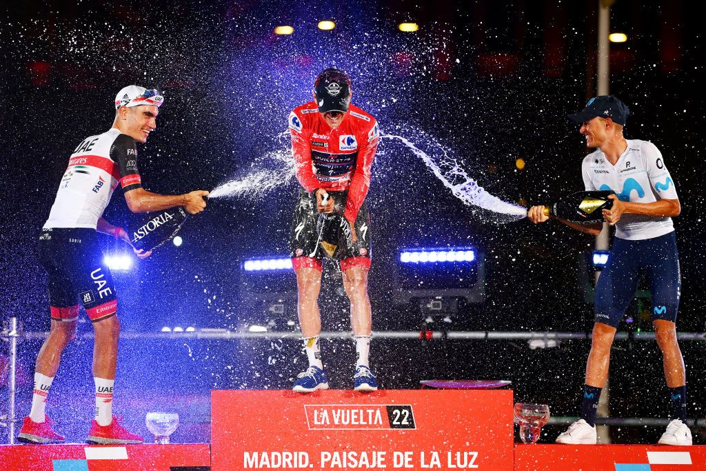 MADRID SPAIN SEPTEMBER 11 LR Juan Ayuso Pesquera of Spain and UAE Team Emirates on third place race winner Remco Evenepoel of Belgium and Team QuickStep Alpha Vinyl Red Leader Jersey and Enric Mas Nicolau of Spain and Movistar Team on second place celebrate on the podium during the podium ceremony after the 77th Tour of Spain 2022 Stage 21 a 967km stage from Las Rozas to Madrid LaVuelta22 WorldTour on September 11 2022 in Madrid Spain Photo by Tim de WaeleGetty Images
