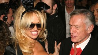 Anderson and Hugh Hefner celebrating Playboy’s 50th in New York City in 2003