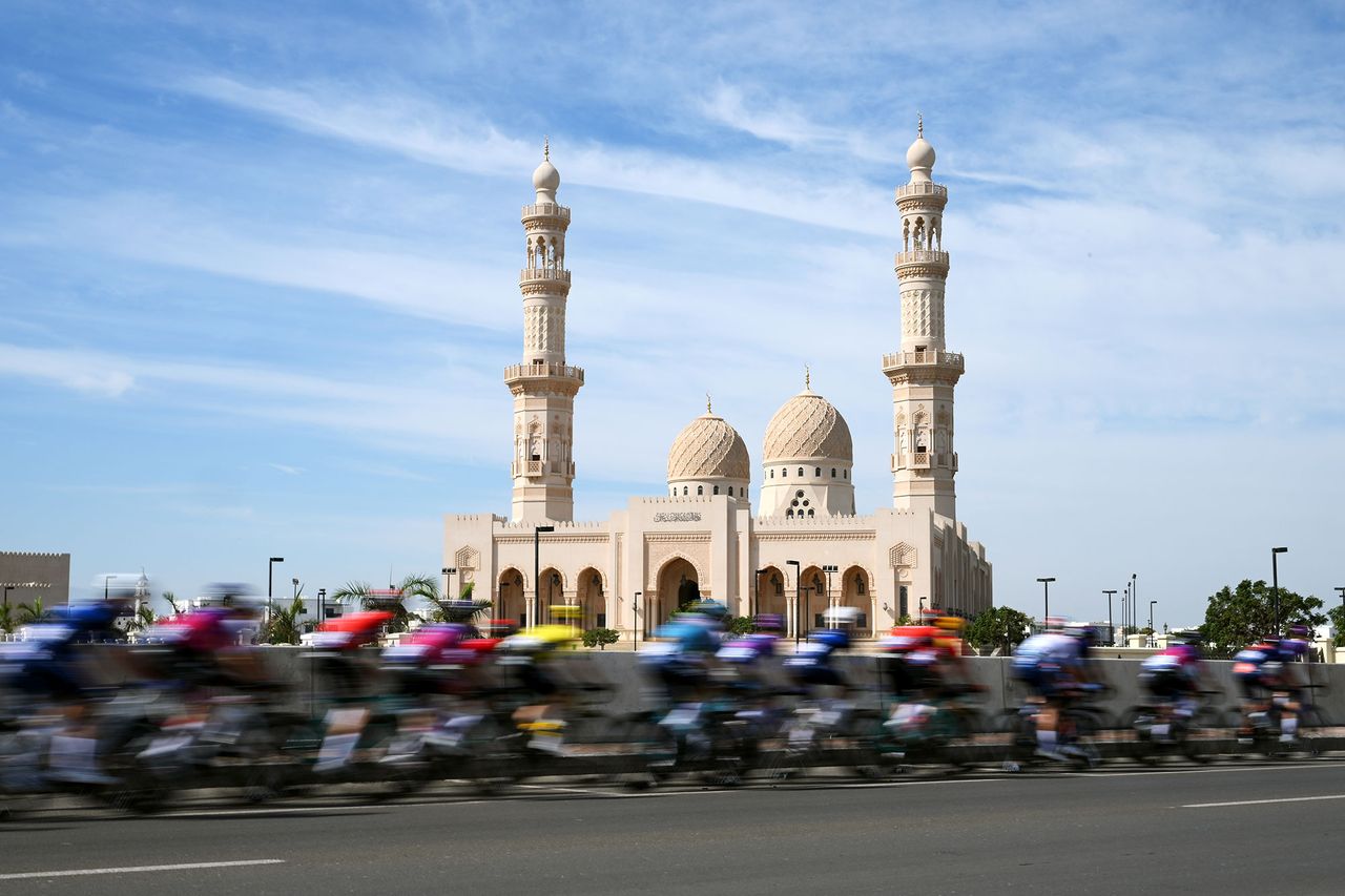 AL BUSTAN, OMAN - FEBRUARY 07: A general view of the peloton passing in front a mosque during the a 3rd Muscat Classic 2025 One day race from Al Mouj to Al Bustan on February 07, 2025 in Al Bustan, Oman. (Photo by Alex Broadway/Getty Images)