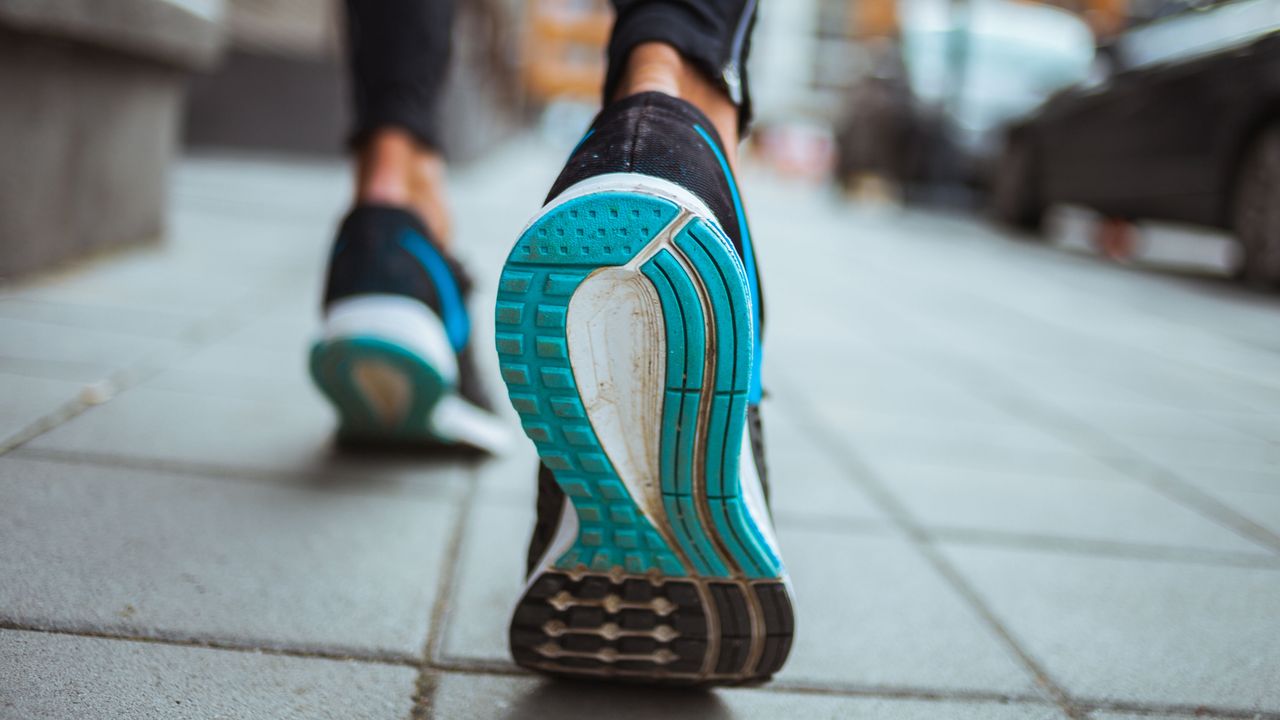 Close up of walking shoes vs running shoes