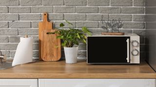 Microwave on wooden countertop