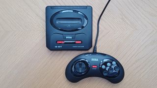 Sega Mega Drive Mini 2 review; a photo of a games console and controller from above