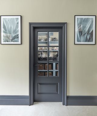 Pantry door ideas with a half-glazed wooden door to walk-in pantry