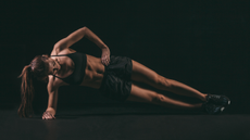 A woman performing the side plank