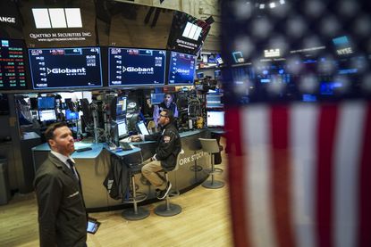 Traders at the NYSE at the closing bell