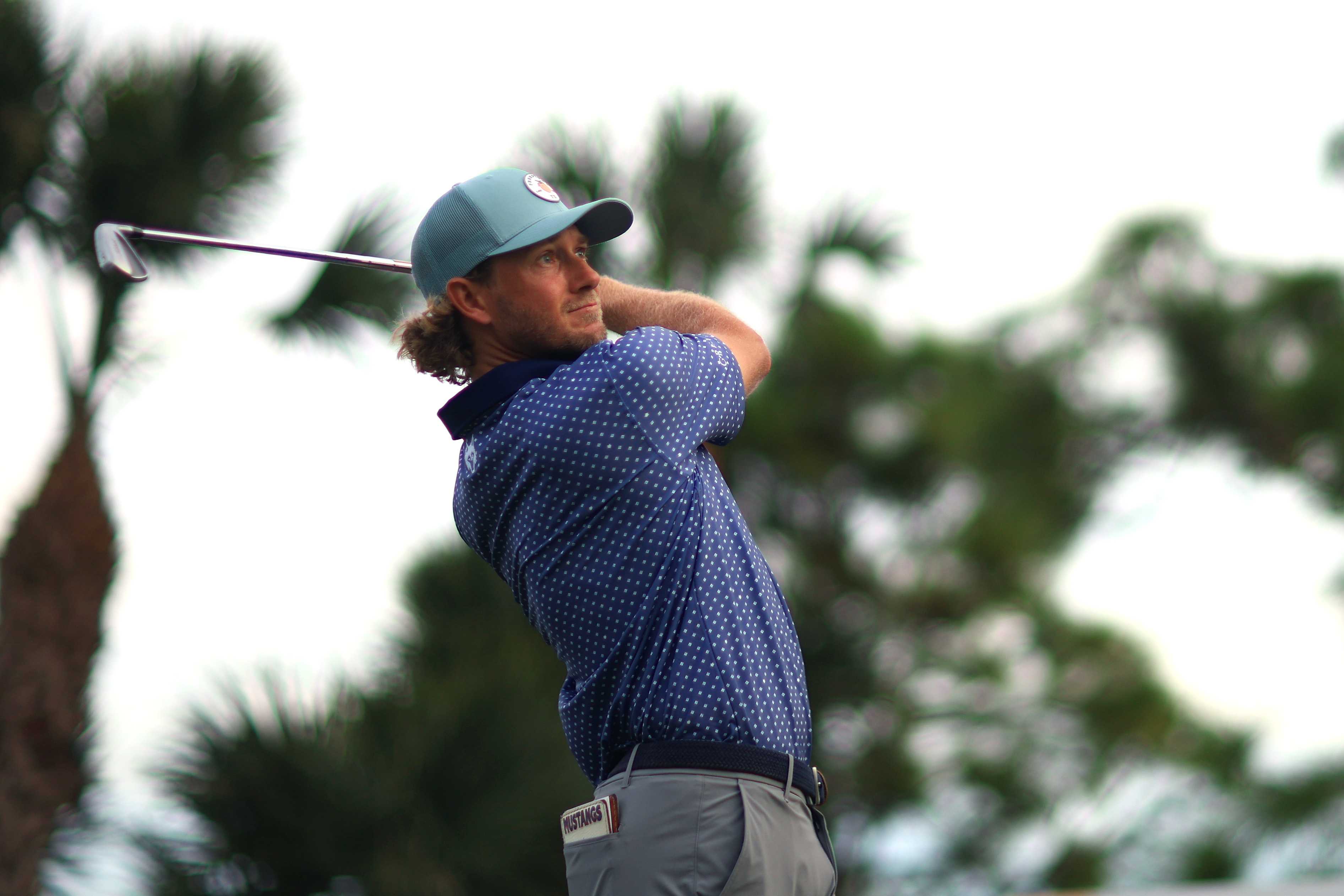 Austin Smotherman hits an approach into the green