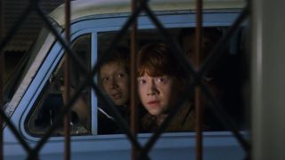 Ron and Fred and George looking into Harry's room from their flying car.