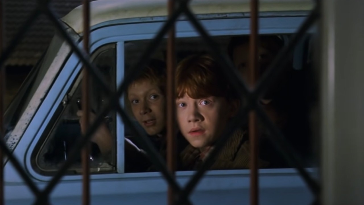 Ron and Fred and George looking into Harry's room from their flying car.