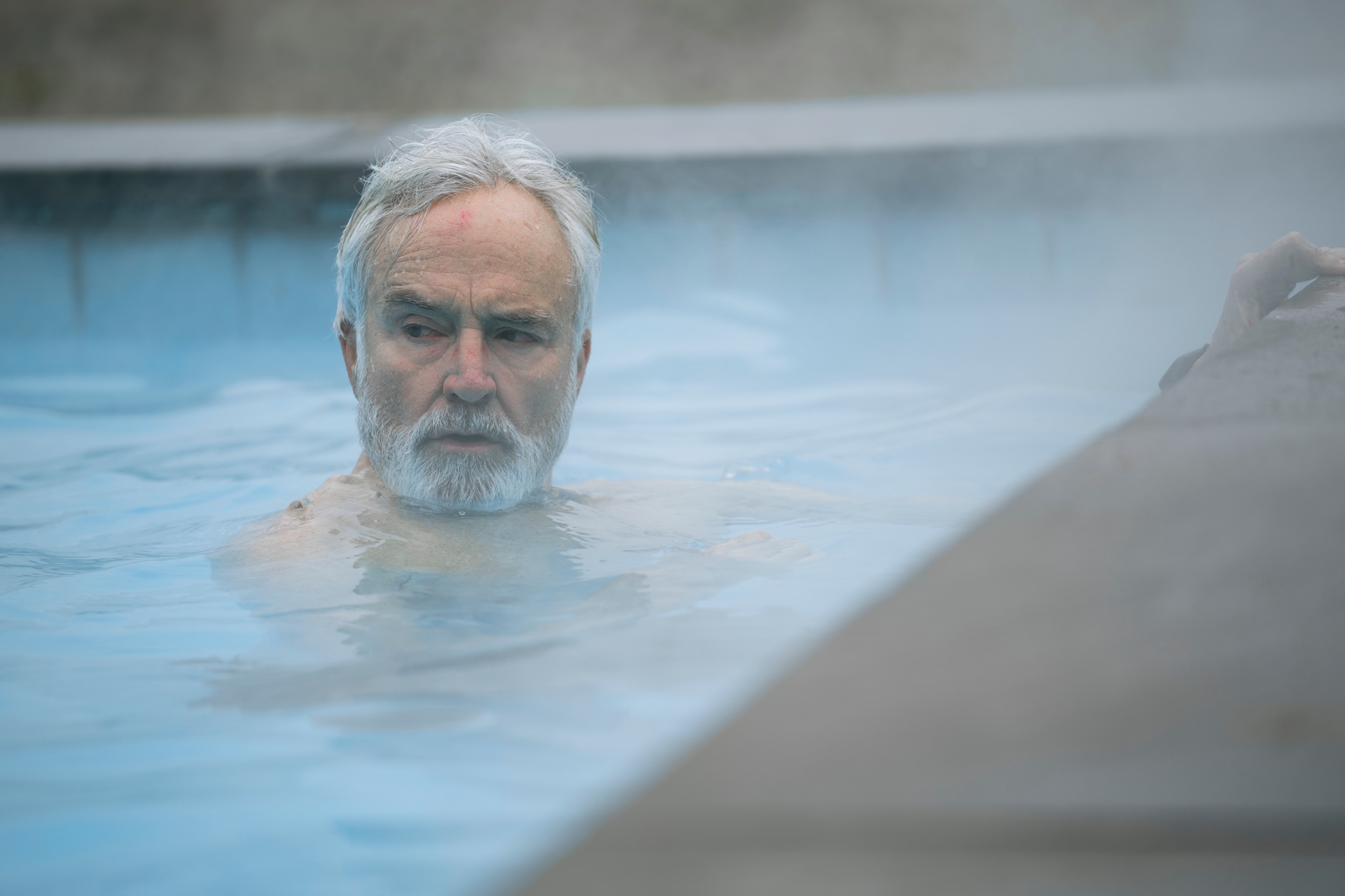 bradley whitford in a heated pool in the diplomat season 3