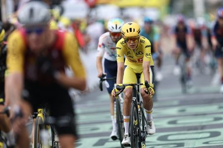 Uno-X Mobility team's Norwegian rider Torstein Traeen wearing the overall leader's yellow jersey crosses the finish line of the 5th stage of the 113th edition of the Tour de France cycling race, 158 km between Lannemezan and Pau in southwestern France, on July 8, 2026. (Photo by Anne-Christine POUJOULAT / AFP)