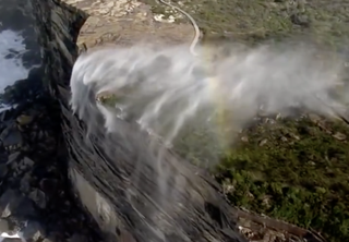 A 'reverse waterfall' flowing backwards onto the land