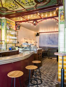 Clown bar interior with colourful hand-painted glass ceilings