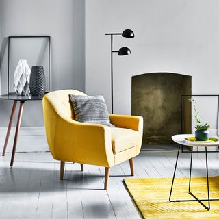 room with grey wall and yellow sofa