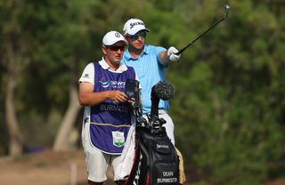 Dean Burmester chats to his caddie during the 2021 DP World Tour Championship