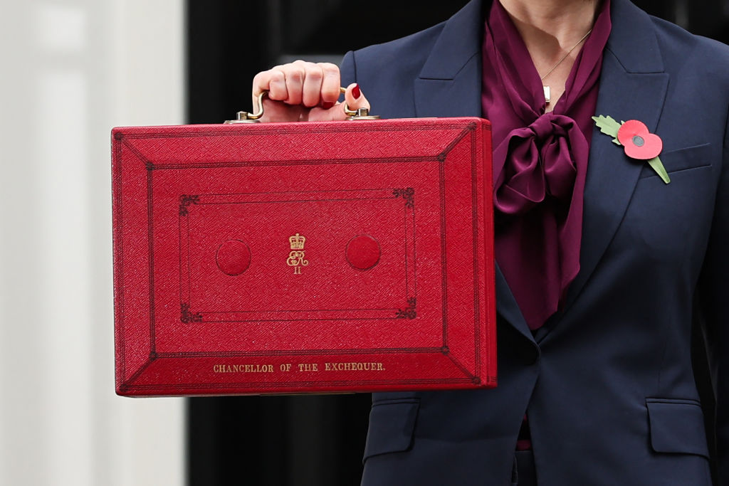 Britain's Chancellor of the Exchequer Rachel Reeves poses with the red Budget Box