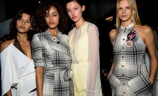 Model wears white, grey checked and yellow dresses