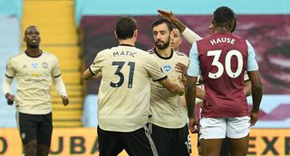 Manchester United’s Bruno Fernandes (centre) celebrates scoring his side’s first goal of the game during the Premier League match at Villa Park, Birmingham