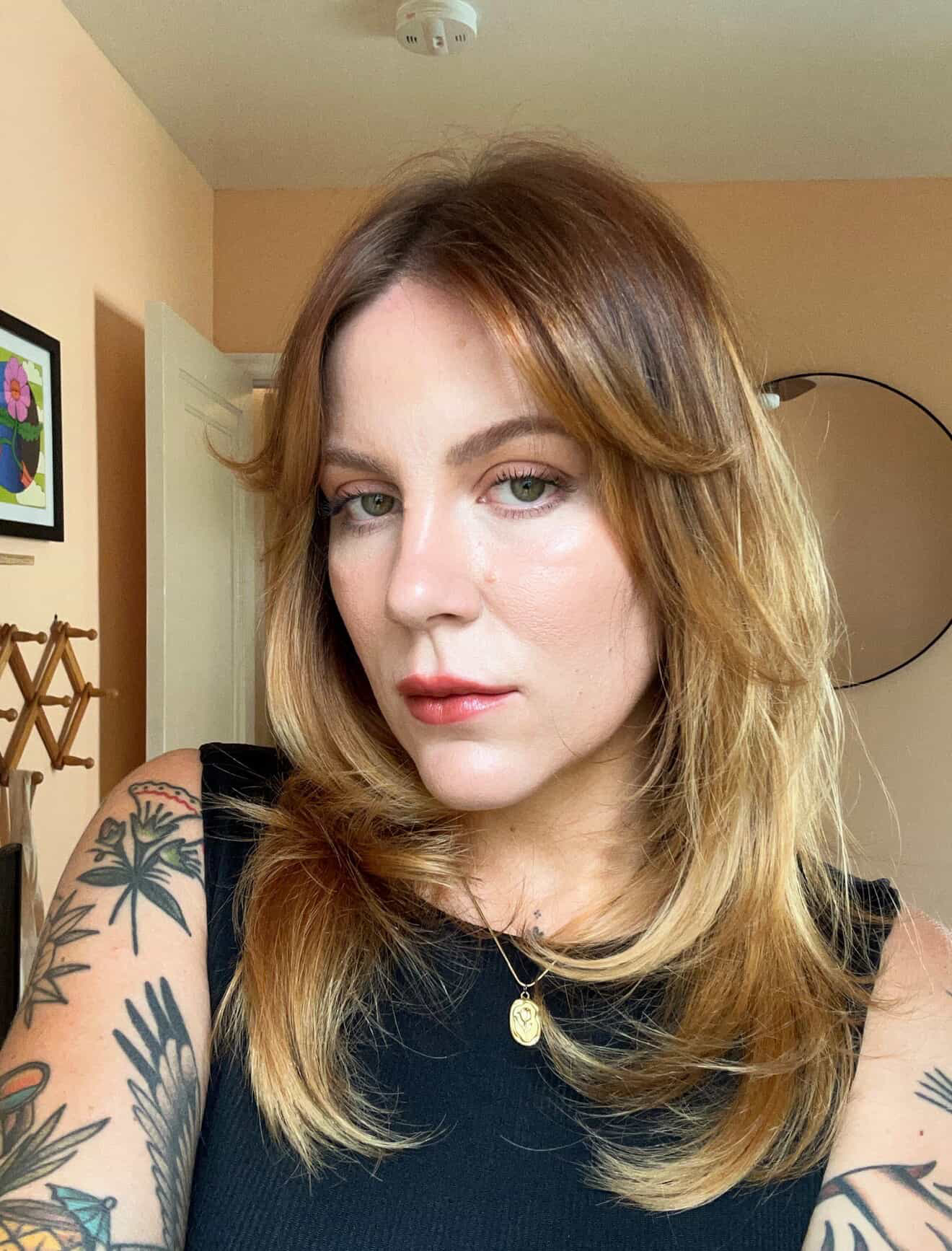 Mariah Downing shows off her microbladed eyebrows.