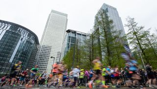 Participants run through Canary Wharf during The TCS London Marathon on Sunday 23rd April 2023