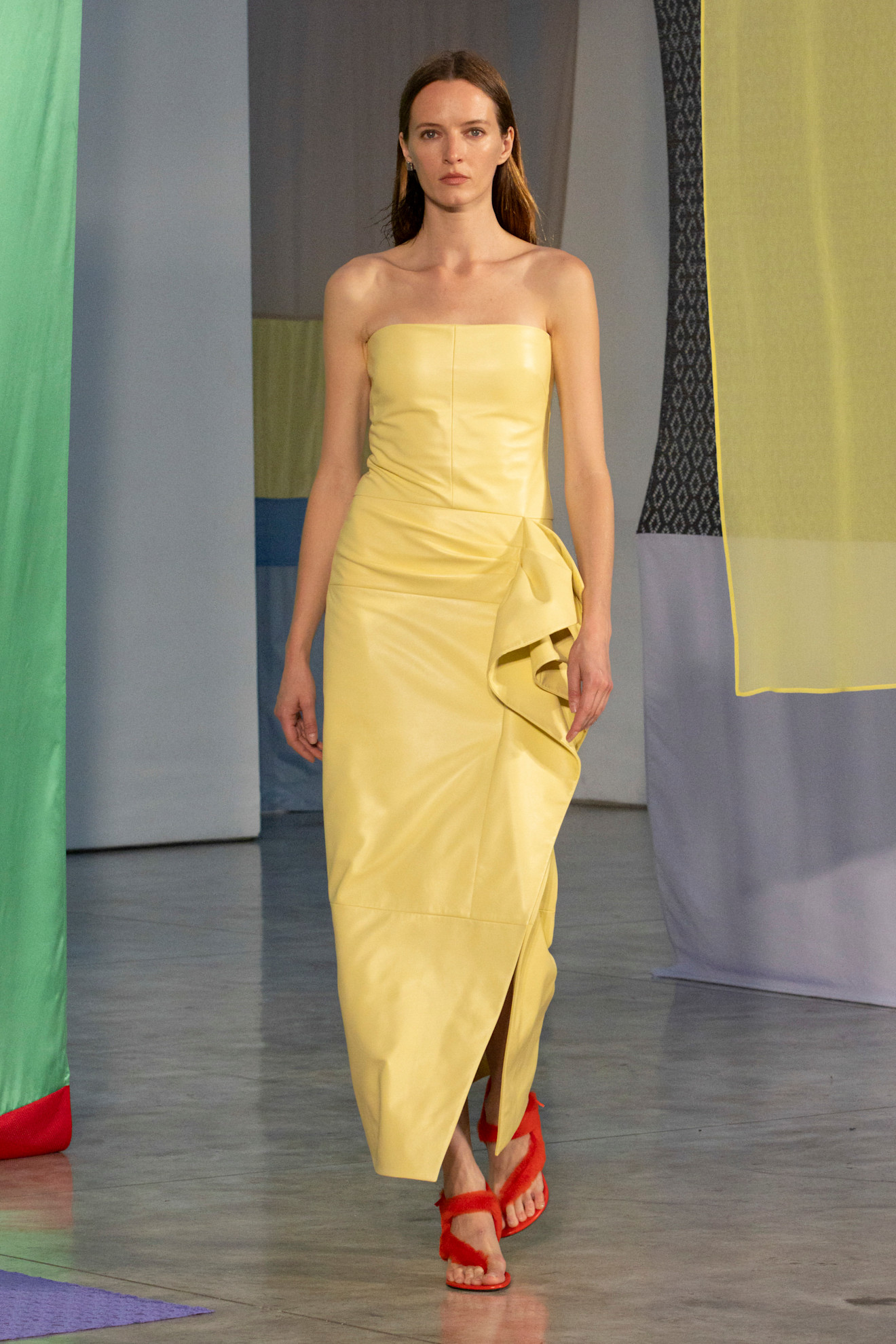 A woman walks down the runway in an unexpected color combination