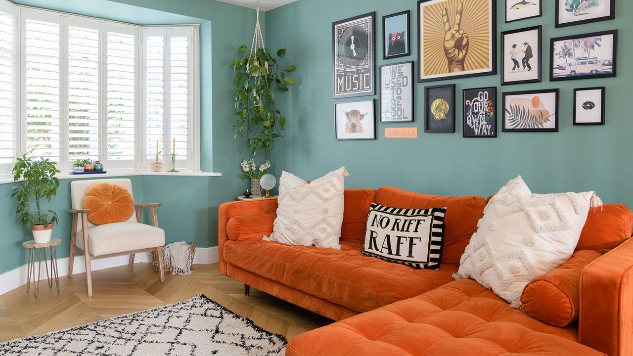 green living room with orange sofa