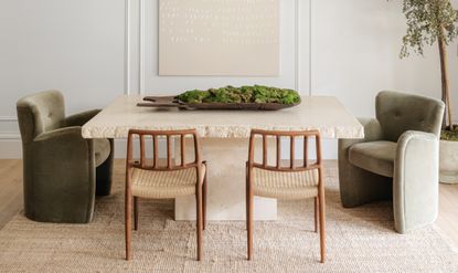 minimalist dining room with wood chairs and stone table