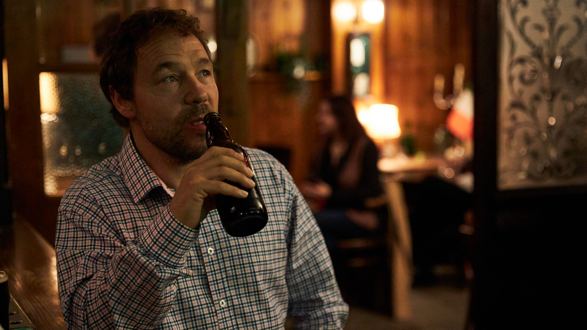 Matthew (Stephen Graham) drinks a beer in The Walk-In