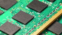 Macro view of the group of computer PC DRAM memory modules circuit board PCB with selective focus effect